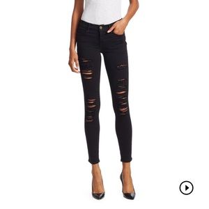 Black shredded skinny jeans